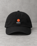 HALT. Dot Cap - black low-profile baseball cap with embroidered coral dot logo, front view