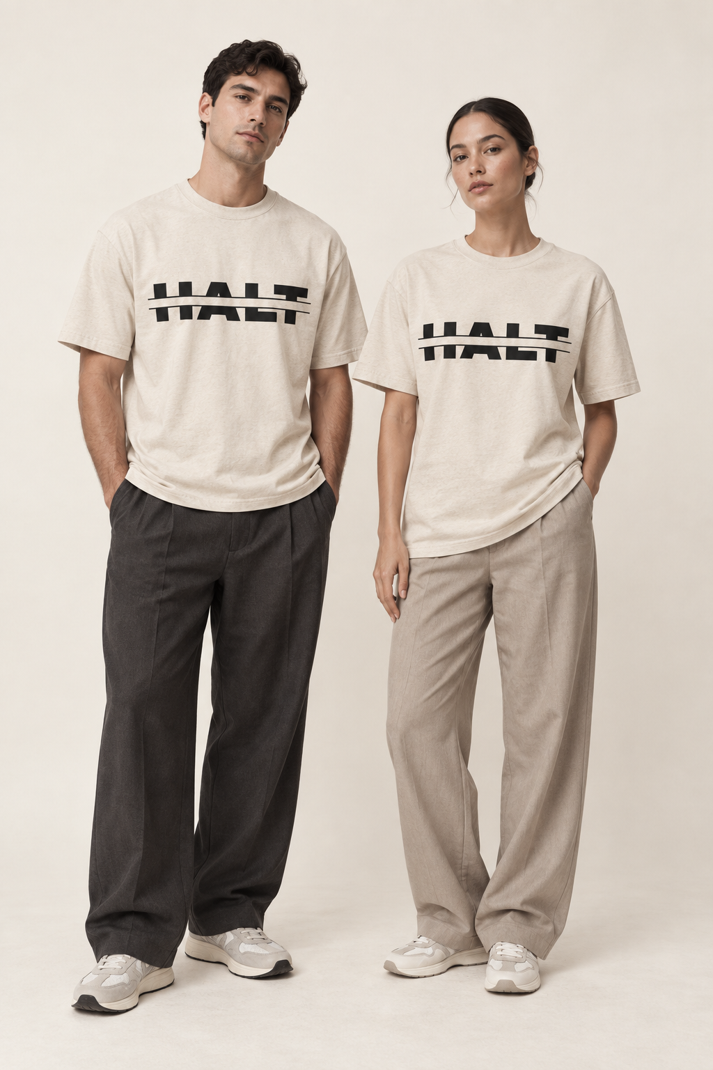 Man and woman wearing the HALT. Split Logo Tee in oatmeal, unisex streetwear t-shirt styled with wide leg trousers